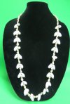36 inches Wholesale shell leis made with tiny brown nassarius shells and white bubble shells, luau party supplies - $8.40 a dozen. 