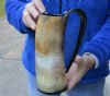 Buffalo horn mug half polished and half rustic carved measuring 8" tall.  You are buying the horn mug pictured for $36