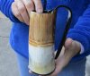 Buffalo horn mug half polished and half rustic carved measuring 6-1/2" tall.  You are buying the horn mug pictured for $29