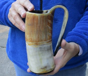 Cow horn mug half polished and half rustic carved measuring 6-1/2" tall for $29