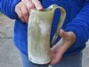 Polished buffalo horn mug measuring approximately 6-1/2 inches tall. You are buying the horn mug pictured for $26