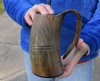 Buffalo horn mug carved with full rustic look measuring 6-1/2 inch tall. You are buying the horn mug pictured for $29