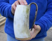 Polished buffalo horn mug with wood base/bottom measuring approximately 6-1/2 inches tall. You are buying the horn mug pictured for $26