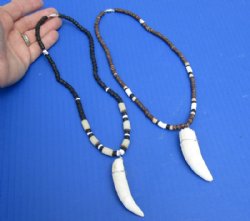 2 pc Coconut bead necklaces with 2-1/2 and 2-3/4 inch Alligator tooth wrapped with a silver color wire