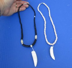 2 pc Coconut bead necklaces with  2 and 2-1/4 inch Alligator tooth wrapped with a silver color wire - $20/lot
