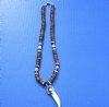 Wholesale alligator tooth necklaces with silver colored alligator design cap with black, brown and white coco beads with tan and white shell beads - Packed: 3 pcs @ $5.00 each; Packed: 12 pcs @ $4.50 each