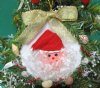 Wholesale Sun Shell with Santa face, green garland border and gold bow ornament - 3-1/2 inches long - Packed: 10 pcs @ $1.60 each
