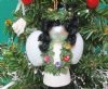 Wholesale Strombus and Cockle shell angel with black hair and green garland necklace ornament - 2-1/2 inches long - Packed: 10 pcs @ $1.60 each; Packed: 30 pcs @ $1.40 each