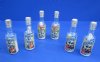 Wholesale Message in a Bottle with Assorted Natural shells and sand novelty with multi-colored labels, in 3 different designs that say "Pirate's Rum Florida" - Packed: 6 pcs @ $1.60 each; Packed:54 pcs @ $1.40 each