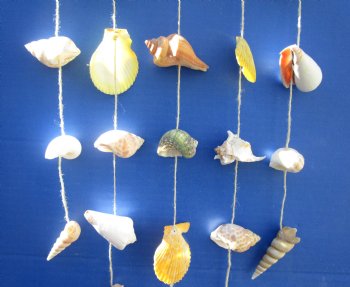 Wholesale Assorted Natural shell wall hanger 19 inches - 6 pcs @ $2.50 each; 24 pcs @ $2.25 each