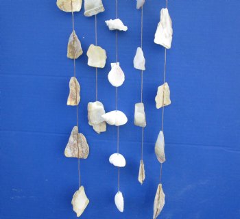 Wholesale White and Natural Mop shells on a driftwood hanger 19 inches - 6 pcs @ $1.80 each; 30 pcs @ $1.60 each