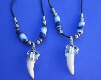 3/4 to 1-1/2 inch wholesale alligator tooth necklaces with tiny gator and purple, blue and white abstract design beads, 20 inches in length - Packed 3 @ $4.25 each; Packed: 12 pcs @ $3.75 each