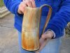 Buffalo horn mug carved with full rustic look measuring 8 inch tall. You are buying the horn mug pictured for $36