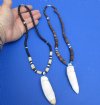 2 pc Coconut bead necklaces with 2-3/4 inch Alligator tooth wrapped with a silver color wire - You will receive the ones in the photo for $28/lot