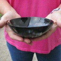 Wholesale Polished buffalo horn bowl measuring 6" long by 3" deep.  You are buying a buffalo bowl similar to the ones pictured - Packed: 2 pcs @ $12.00 each; Packed: 12 pcs @ $10.50 each