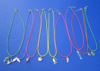 Wholesale Assorted Sea life Charm necklace on 18" multi-colored cord with gold colored clasp - Packed: 5 pcs @ $2.00; Packed: 25 pcs @ $1.75 each