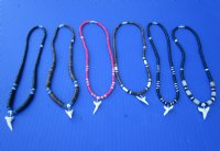 Wholesale Mako Shark tooth necklace 1 to 1-1/8 inch wrapped with silver colored wire on an assorted color coconut bead necklace - Packed: 5 pcs @ $4.00 each; Packed: 25 pcs @ $3.50 each